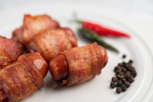 Sausage links with peppers and cucumbers photo