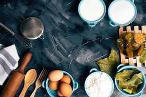 Top view of cooking ingredients on a black background photo