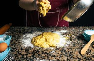 Person making homemade pasta photo