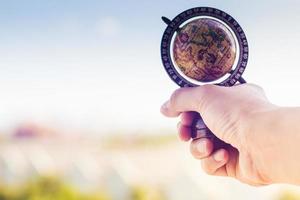 Person holding a globe photo