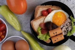 Vegetable salad with bread and boiled eggs photo