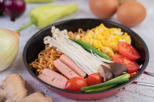 Stir-fried noodles with corn, golden needle mushroom, tomato, sausage and edamame photo