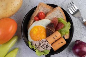 Vegetable salad with bread and boiled eggs photo