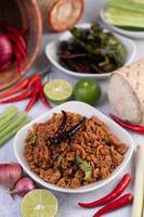 Spicy minced pork in a white bowl photo