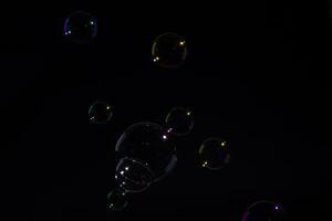 Bubbles on black background photo