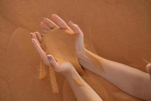 Hands in sand photo