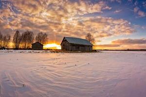 Wooden house at sunset photo