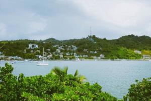 Sailboat in tropical waters photo