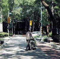 Taipei, Taiwan, 2020 - Woman walking with a stroller photo