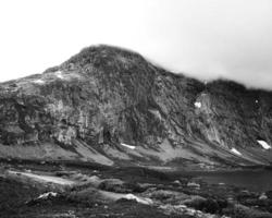 Grayscale of a rocky mountain photo