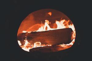 Burning wood in a fireplace photo