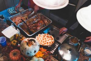 People grabbing food from trays photo