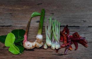 Thai food ingredient for Tom yum on old wooden background. photo