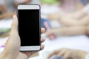 Close-up of a person holding a phone mock-up photo