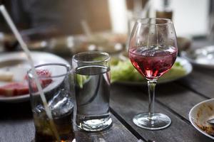 Glass of wine on a table photo