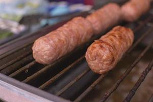 Close-up of sausages on a grill photo