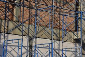 Blue scaffolding on a building photo