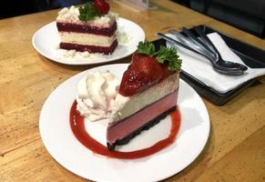 Two pieces of strawberry cheesecake