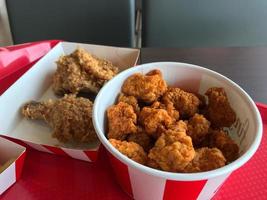 Bucket with fried chicken in it photo