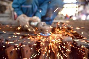 Abstract sparks flying from metal worker photo