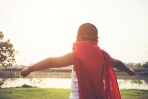 Super boy showing his powerful flying arms photo