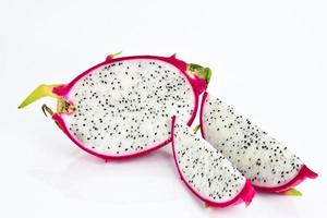 Sliced dragon fruit on white background photo