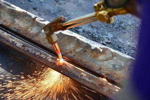 Worker cutting metal plate photo