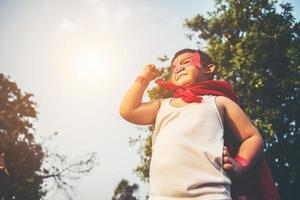 Super boy showing his powerful flying arms photo