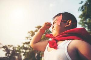 Super boy showing his powerful flying arms photo