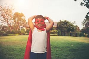 Super boy showing his powerful flying arms photo