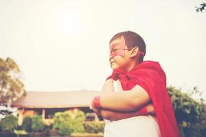 Super boy showing his powerful flying arms photo