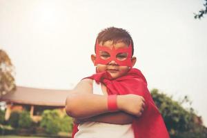 Super boy showing his powerful flying arms photo