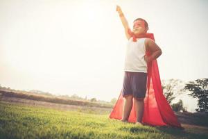 Super boy showing his powerful flying arms photo