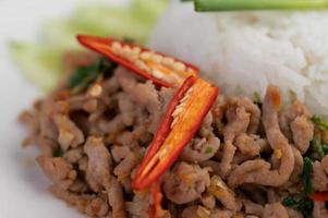 Stir fried pork with basil and fried egg photo