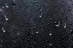 Water droplets on black background photo