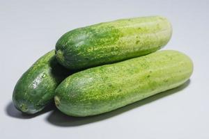 Cucumbers on white background photo