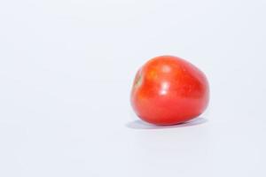 Tomato on white background photo