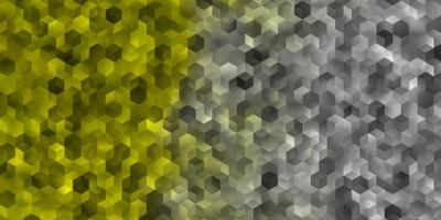 Light Yellow vector background with hexagons.