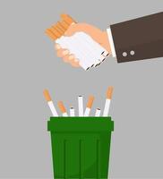 Hand throwing cigarettes in the trash bin vector