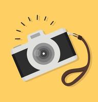 Vintage camera with strap vector