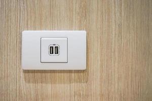 USB socket port with USB signage icon on wooden wall background, Prepared to use. photo