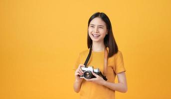 Woman tourist holding camera photo