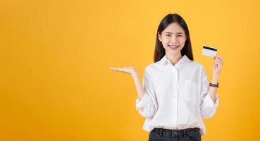 Woman holding a credit card photo