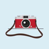 red vintage camera with camera strap vector