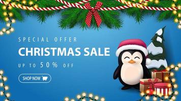 Special offer, Christmas sale, up to 50 off, blue discount banner with wreath of Christmas tree branches and penguin in Santa Claus hat with presents near the wall vector