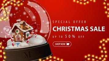 Special offer, Christmas sale, up to 50 off, red discount banner with large snow globe with Christmas gingerbread house inside vector