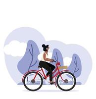 woman riding a bicycle and wearing a medical mask vector