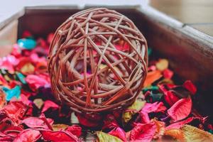 Red rose paper and a ball of wooden strings photo