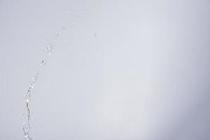 Water over grey background photo