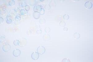 Bubbles in front of greyish-white background photo